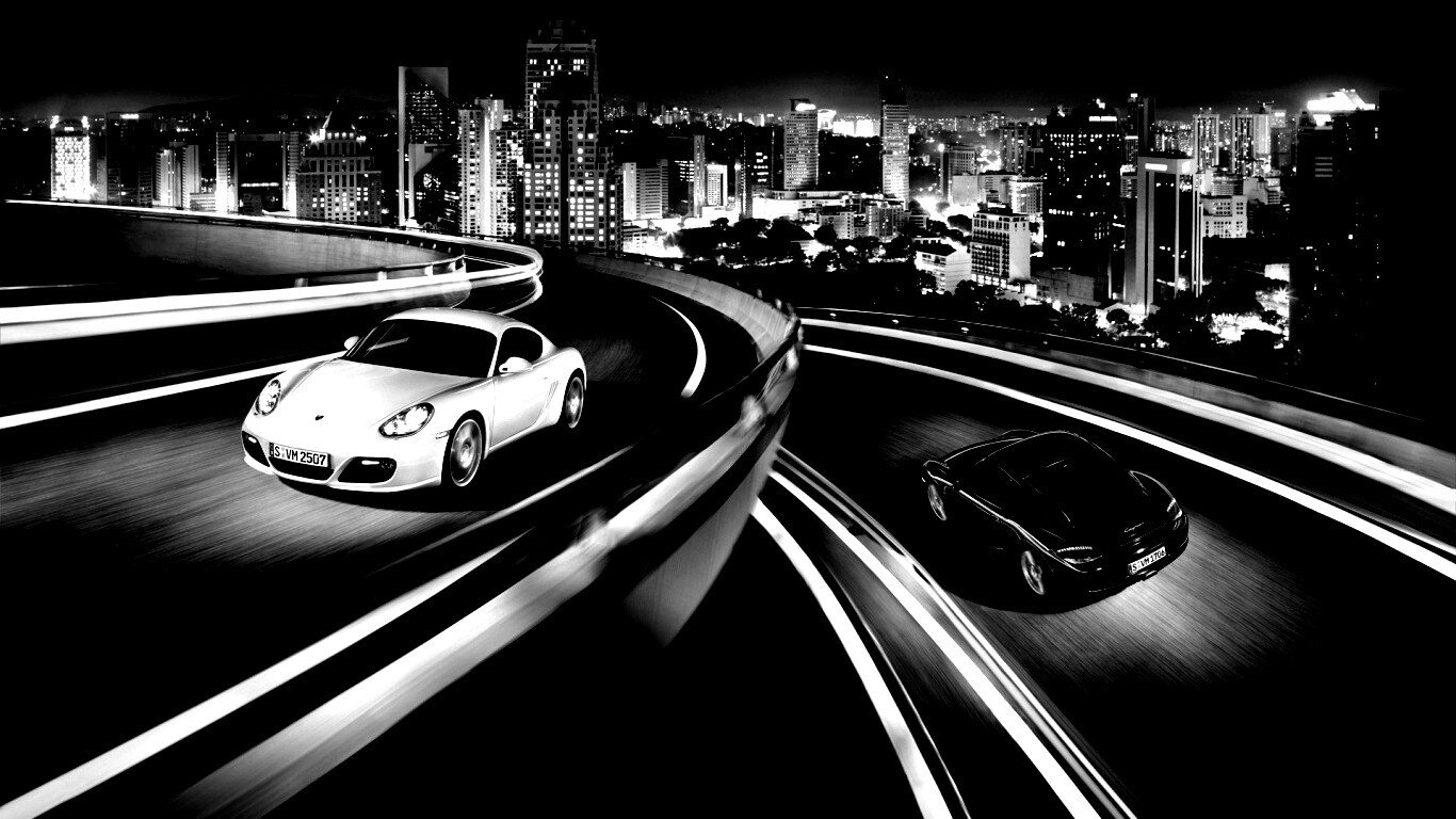 Черный и белый Porsche на автомагистрале. обои