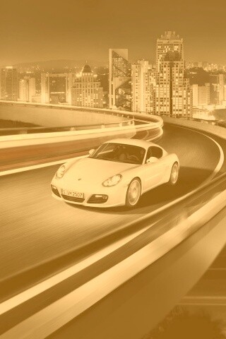 Черный и белый Porsche на автомагистрале. обои