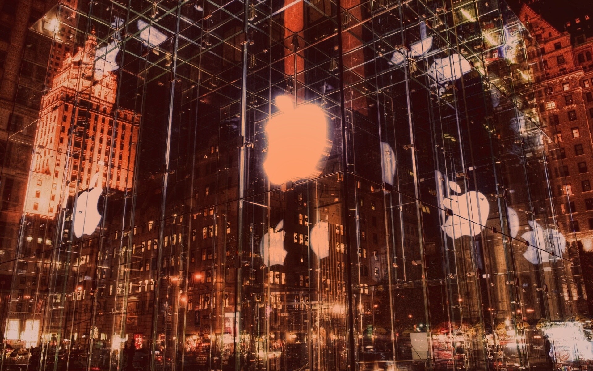Отражение логотипа Apple в стеклянном здании обои