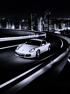 Черный и белый Porsche на автомагистрале. обои