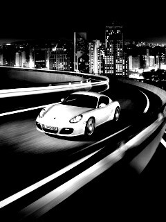 Черный и белый Porsche на автомагистрале. обои